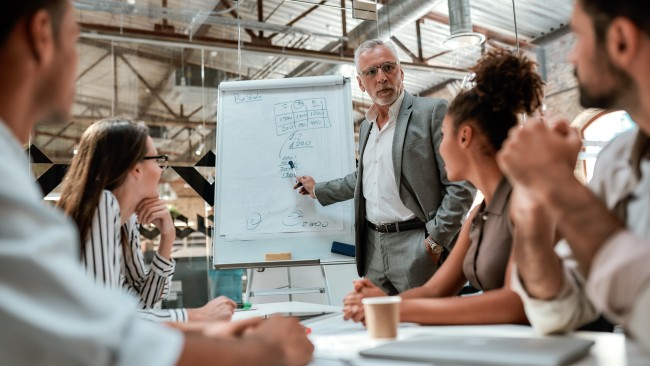 People looking at a flip chart